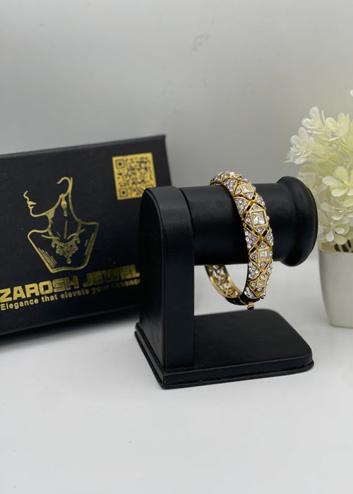 Shop the Mira Spiral Bangle from Zarosh Jewel