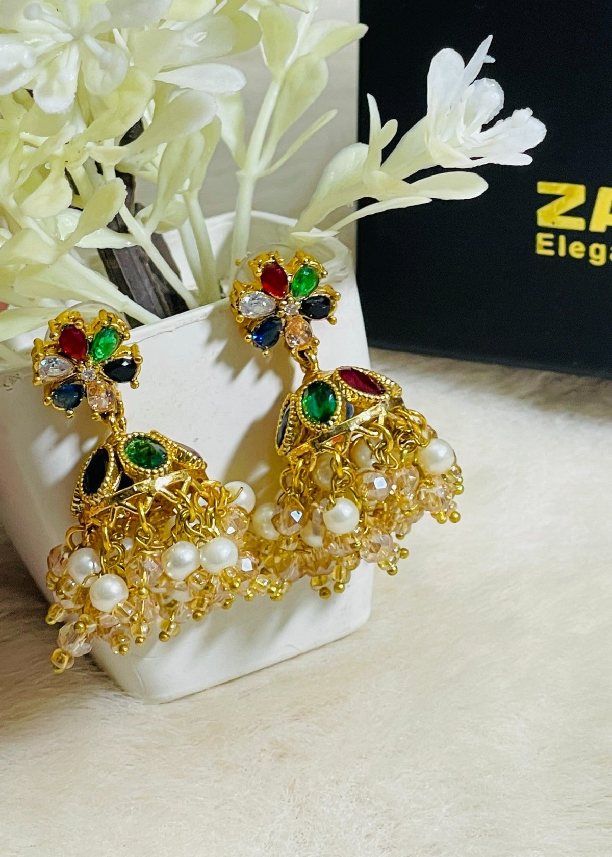 Shop the Zarmin Royal Floral Jhumka Earrings from Zarosh Jewel